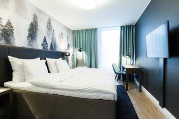 Фото номера Стандартный двухместный номер с 2 отдельными кроватями Отель Hotel Sveitsi г. Хювинкяя 9